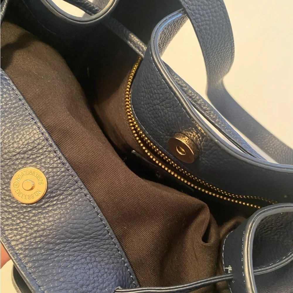 LAGGO || Andrea Tassel Drawstring Hobo Bag Pockets Pebbled Leather Navy‎